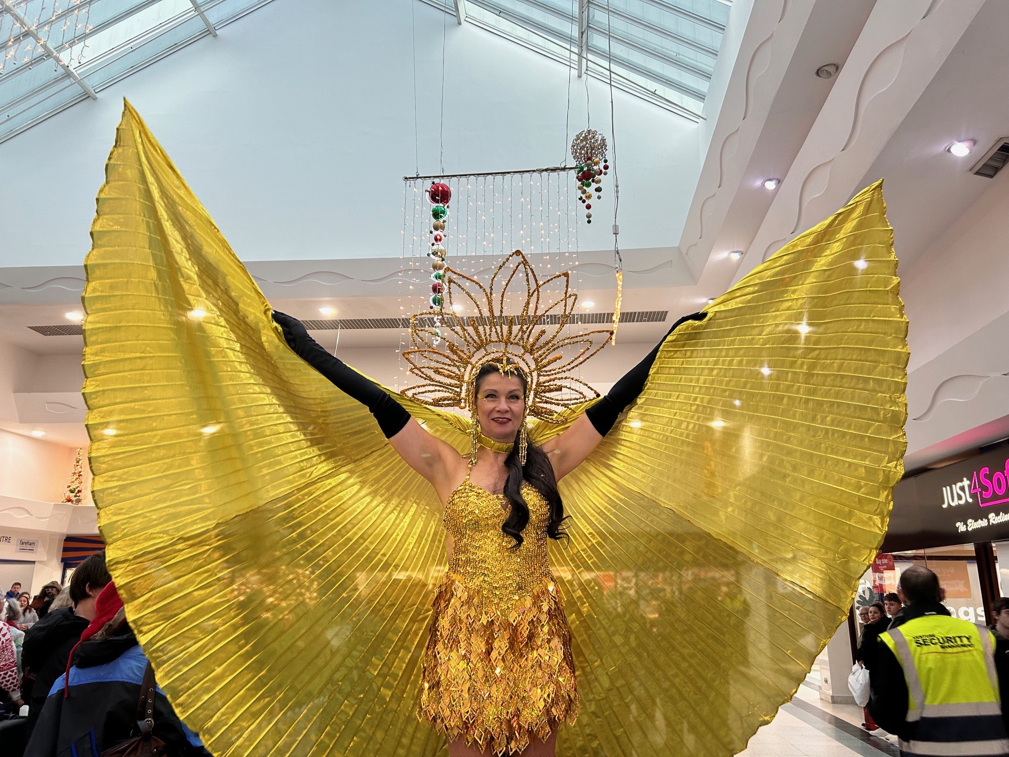 Christmas entertainer with gold wings